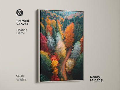 White framed canvas print featuring a colorful forest. This ready-to-hang artwork shows an aerial view of trees in autumn colors. The white frame provides a clean modern look. A perfect addition to any room.