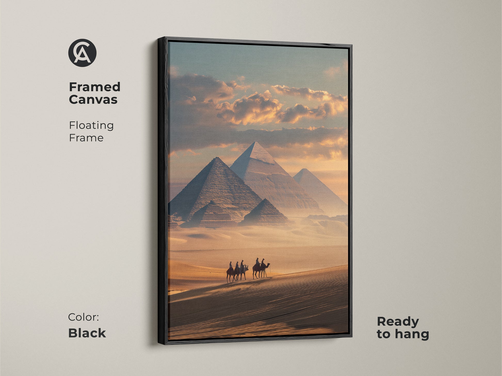 This framed canvas features a floating frame. The photorealistic artwork displays the Egyptian pyramids. A camel caravan traverses the sandy desert. The black frame complements the sandy yellow and teal art. This travel theme wall decor is ready to hang.