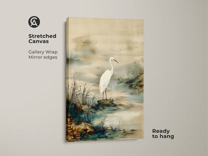 Stretched canvas print featuring an Egret bird. This Japandi style wall art showcases a minimalist landscape. Ink wash egret painting in beige and green. Ready to hang in any room.