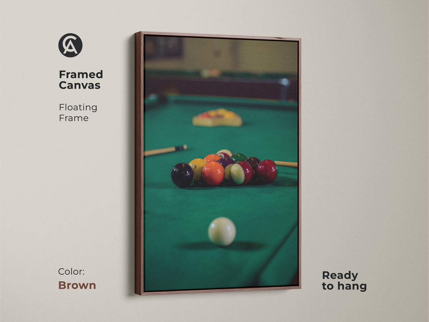 Brown framed canvas features billiard balls on a pool table in emerald green. This floating frame artwork is ready to hang adding a touch of leisure to your space. A perfect piece of sports wall art and a fantastic gift for pool players.