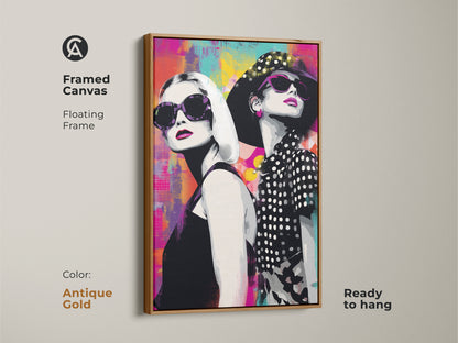 Framed canvas with an antique gold floating frame showing a pop art portrait of two women with sunglasses. The abstract background uses magenta teal and yellow colors. This ready-to-hang canvas art adds a unique touch to your decor. A stylish female portrait perfect for bedroom decor. Contemporary artwork.