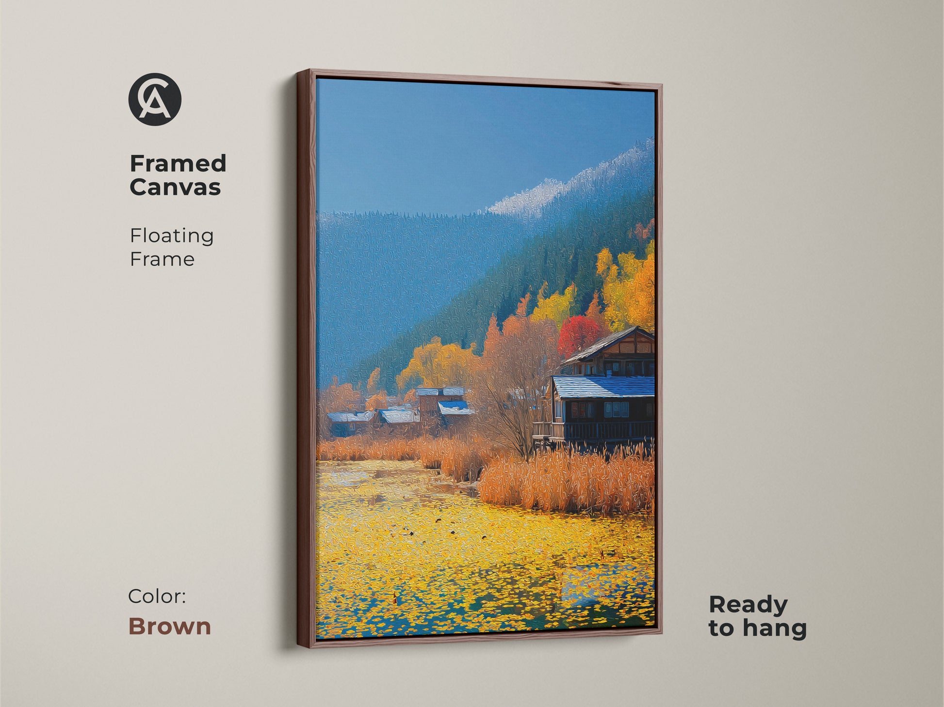Framed Canvas print shows a rustic cabin landscape. The brown floating frame complements the Autumn lake scene wall art. Folk art farmhouse decor ready to hang.