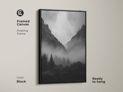 A framed canvas in black showcasing monochrome forest artwork. Black and white landscape art with a floating frame. Features misty pine trees and a modern nature wall decor. Ready to hang and adds a dramatic mountain scene.