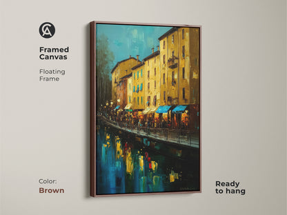 Framed Canvas with a floating brown frame. The artwork is ready to hang. The Italian canal scene features buildings in yellow ochre and deep blue. This impressionistic waterfront painting enhances any residential space.