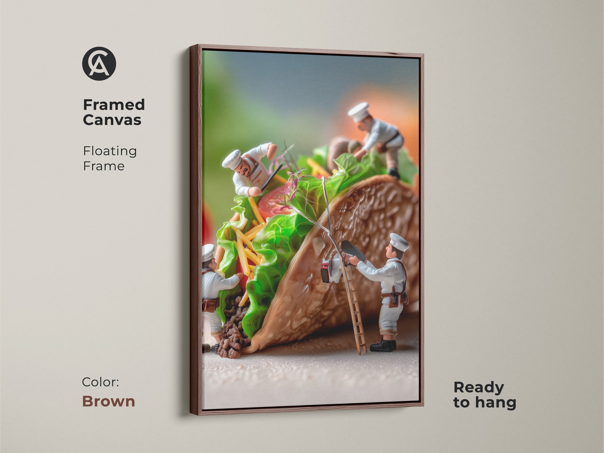 Framed canvas artwork of miniature chefs constructing a taco. The floating frame is brown. This food art brings warmth to your space. The chefs are adding colorful toppings. Ready to hang this piece is a unique culinary art statement.