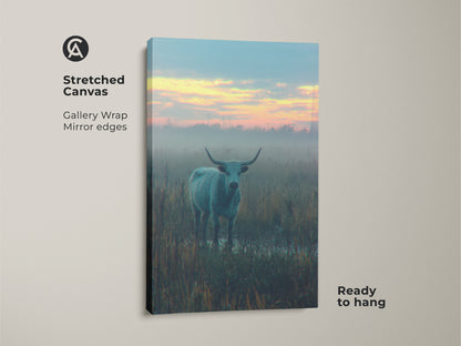 Stretched canvas print featuring a longhorn bull in a foggy field. Gallery wrapped with mirrored edges this artwork is ready to hang. This canvas wall art brings a touch of rural beauty to any space.