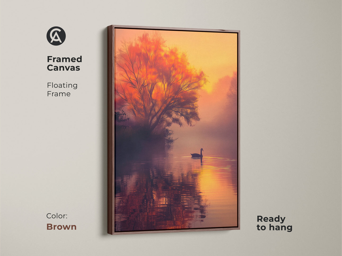 This framed canvas artwork presents a tranquil lake at sunset. A swan is gliding across the water. A fiery tree adds warmth. The floating frame in brown offers a classic look. This ready-to-hang piece brings nature indoors. Find the perfect framed art for your home.