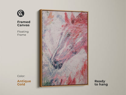 Framed canvas print featuring abstract horse head art with an antique gold frame. This modern equestrian artwork adds a touch of elegance to any space. The canvas print is ready to hang. The artwork showcases energetic brush strokes in pink red and white. It is ideal for horse stables.