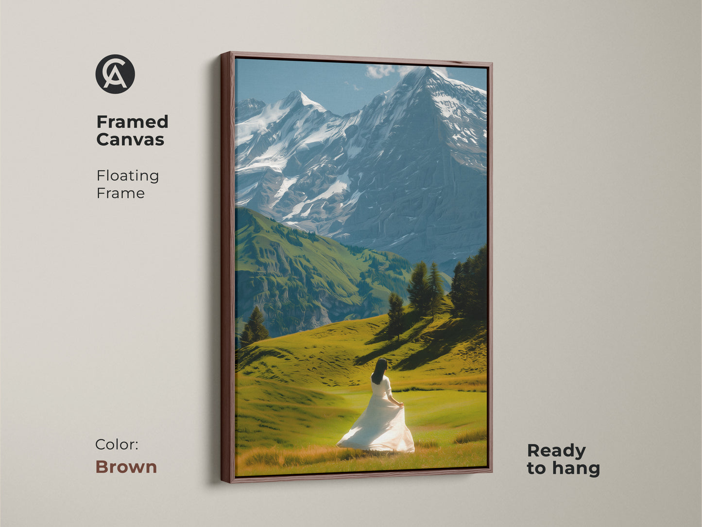 This is a framed canvas print of a mountain landscape with snowy peaks. A woman in a white dress stands in a lush green field. The floating frame is in a rich brown color. The artwork is ready to hang. This fine art mountain print adds warmth to your living room art.