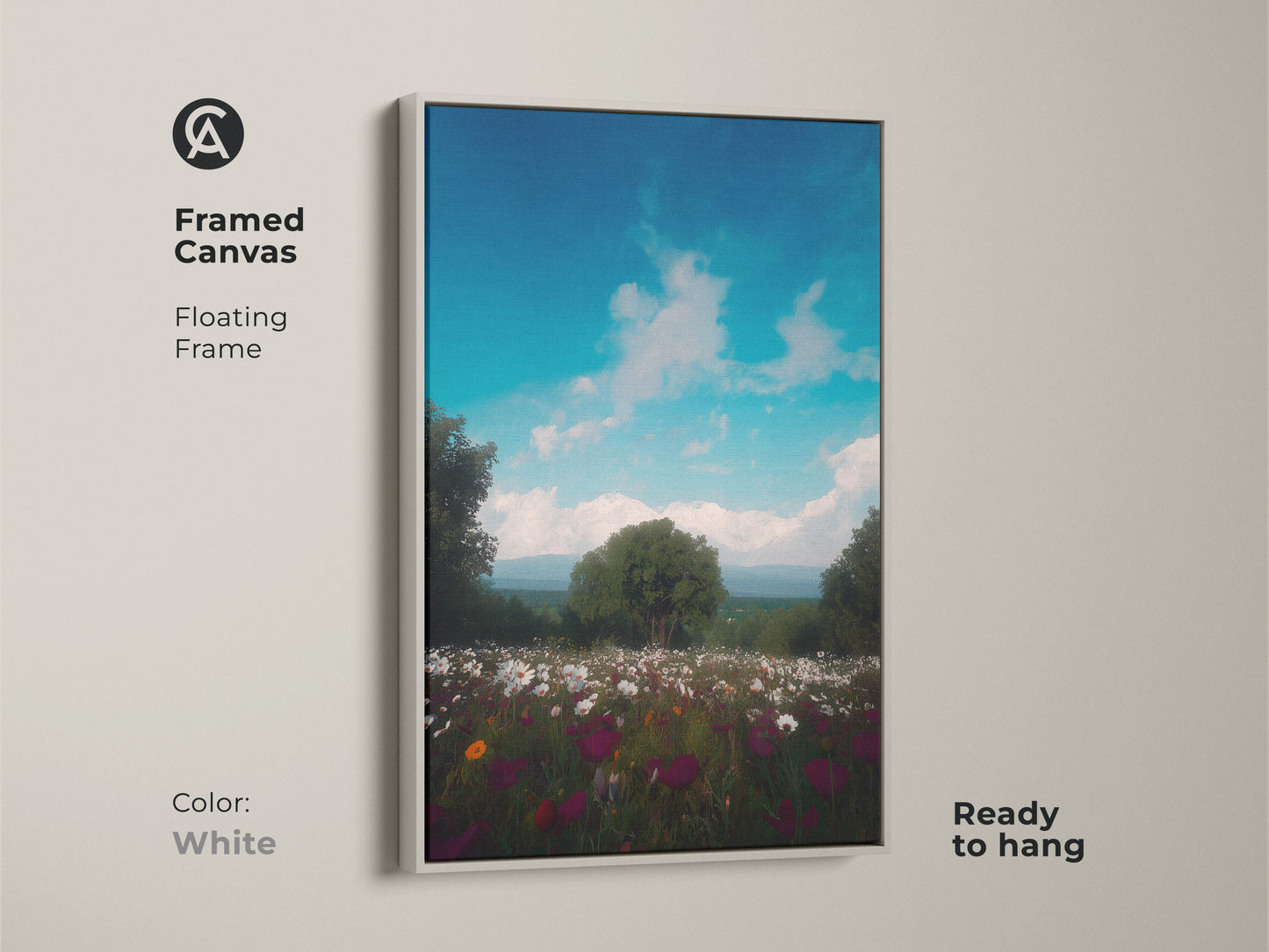 Framed canvas art in a floating frame of a wildflower field. Impressionistic mountain landscape art with a bright blue sky. This boho wall decor complements any interior. The scenic print is ready to hang in a white frame.