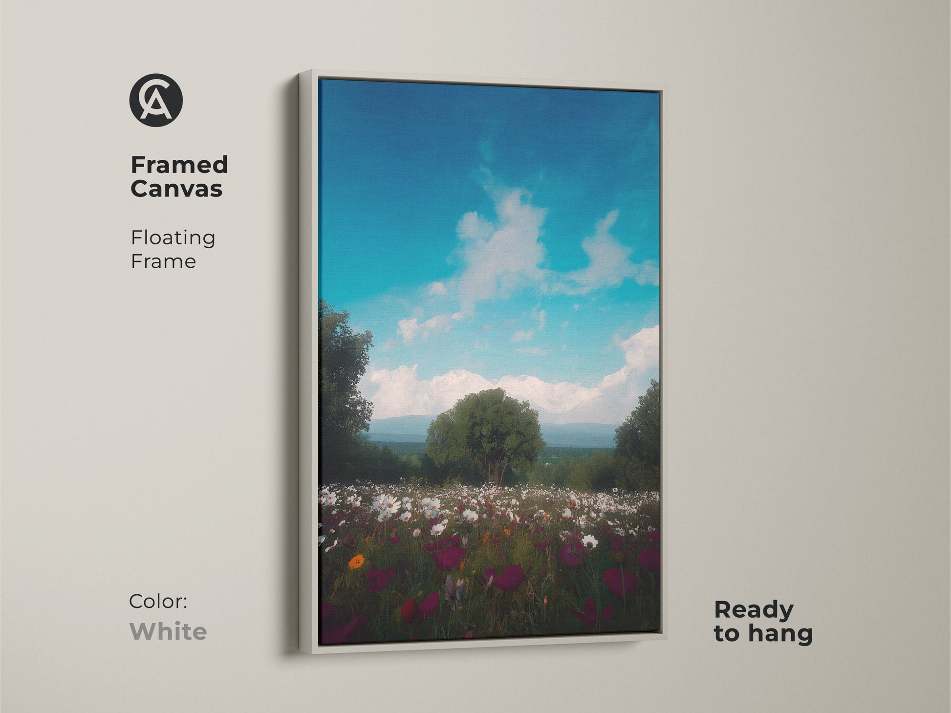 Framed canvas art in a floating frame of a wildflower field. Impressionistic mountain landscape art with a bright blue sky. This boho wall decor complements any interior. The scenic print is ready to hang in a white frame.