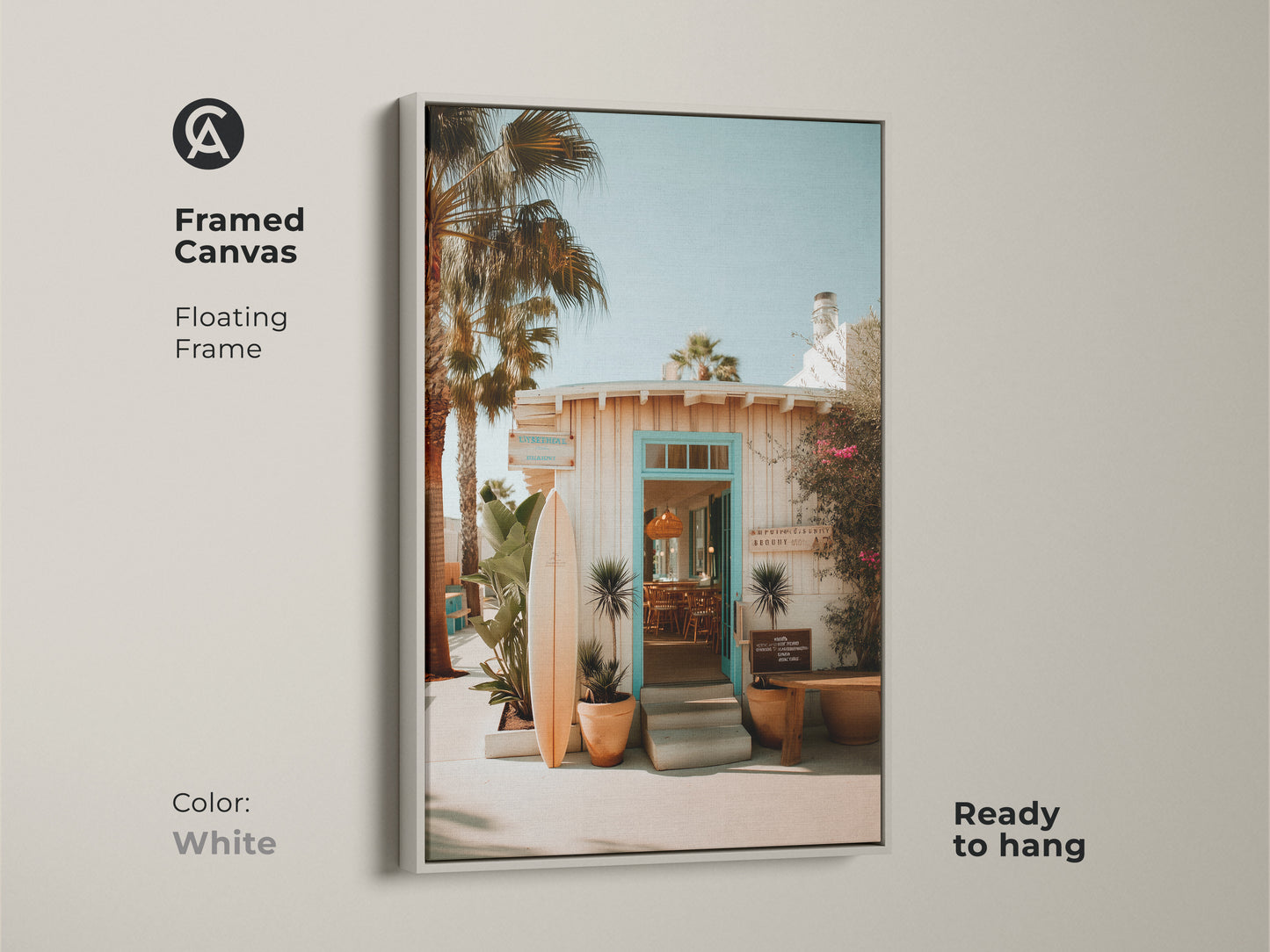 Framed canvas art with a floating white frame displaying a beach resort entrance. A surfboard adds to the coastal atmosphere. Ready to hang and brighten your space. The white frame offers a clean fresh look for this artwork.