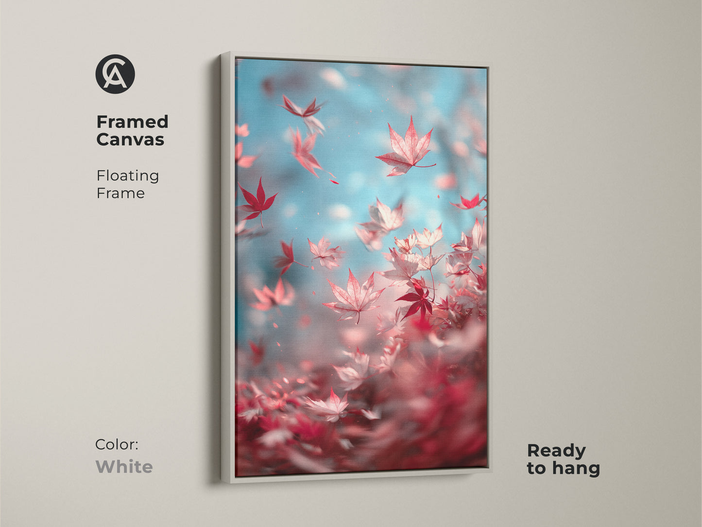 Framed canvas art features vibrant red maple leaves on a blue backdrop. The floating frame is white in color. This striking art print is ready to hang and brings a fresh touch to your decor.