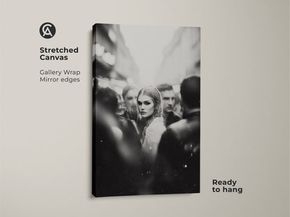 Elevate your decor with this black and white wall art. Featuring a captivating woman's portrait in a street scene. This monochrome street photography is printed on stretched canvas. It's ready to hang in your bedroom or living room. The gallery wrap and mirror edges add a refined touch. Perfect for contemporary home decor.
