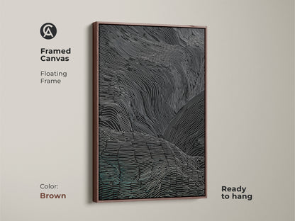 The framed canvas art has a brown floating frame. It features abstract wavy lines in black white and teal. This modern artwork is ready to hang and adds a touch of sophistication. It's a great housewarming gift.
