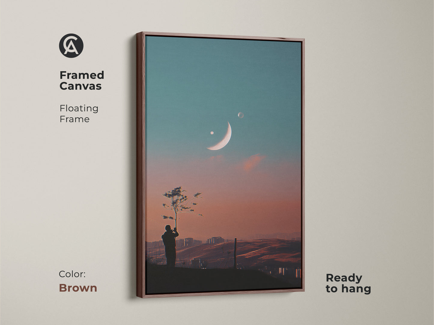 Framed canvas of surreal space artwork. Floating frame in brown. This dreamy moon canvas art is ready to hang. Features a celestial landscape wall art. Perfect for modern bedroom decor. The fantasy tree silhouette print enhances any room.