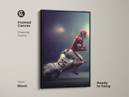Framed American Football Player Tackled Canvas art with a brown floating frame. This sports action wall decor is ready to hang. This man cave wall hanging is a perfect gift for football fans. The red white and blue artwork adds a sporty energetic vibe