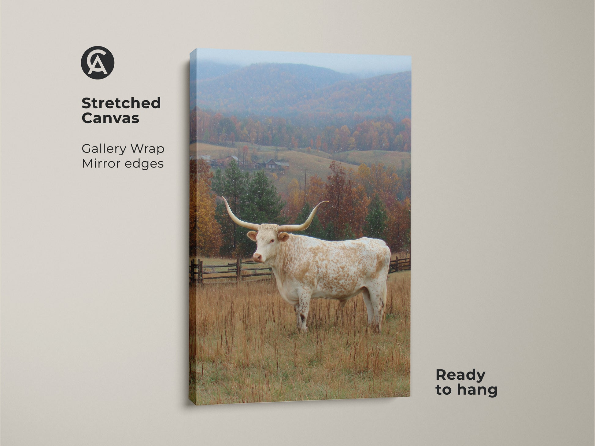 Stretched canvas print featuring a Longhorn in a field. Gallery wrapped with mirrored edges. The canvas is ready to hang. The artwork captures a Longhorn with large horns in front of an autumn landscape with snow.