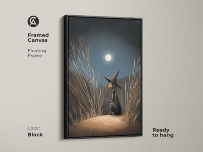 Framed Canvas of fantasy wall art is ready to hang. A witch gazes at the moonlight. The Floating Frame is black. Navy Blue Gold Moonlight Canvas. Find boho bedroom decor here. A perfect Halloween Occasion Gift.