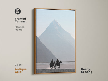 Framed canvas with an antique gold floating frame. Showcases a minimalist cowboy and horse artwork. Misty blue mountain scene creates a peaceful atmosphere. Wall decor adds a touch of classic western art to any room. Ready to hang.