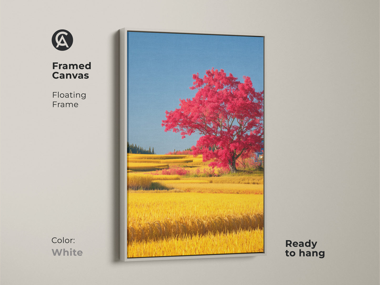 Framed canvas showcasing a red tree in a yellow rice field with a white floating frame. This picturesque landscape print is ready to hang. It complements any modern or minimalist space. The nature scene wall hanging brings a touch of the outdoors inside making it an ideal housewarming gift.