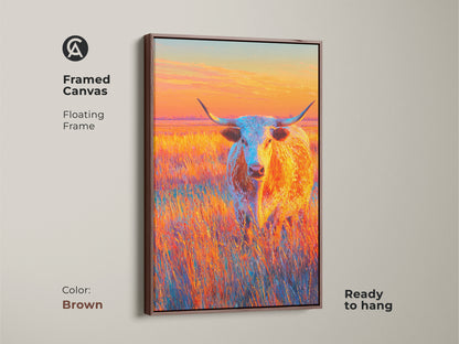 Framed canvas art with a brown floating frame. This artwork features a longhorn in a field during sunset. The canvas is ready to hang. The vibrant colors bring life to any room. Perfect for western art lovers.