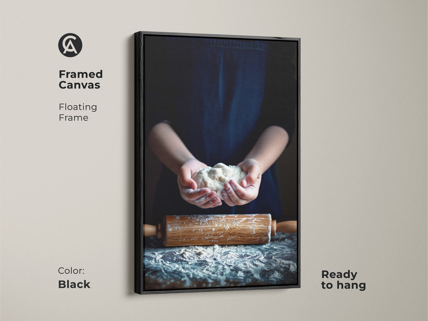 Framed canvas art shows hands holding dough. The floating frame is black. A rolling pin art kitchen piece is ready to hang. This culinary art print creates a warm tone.
