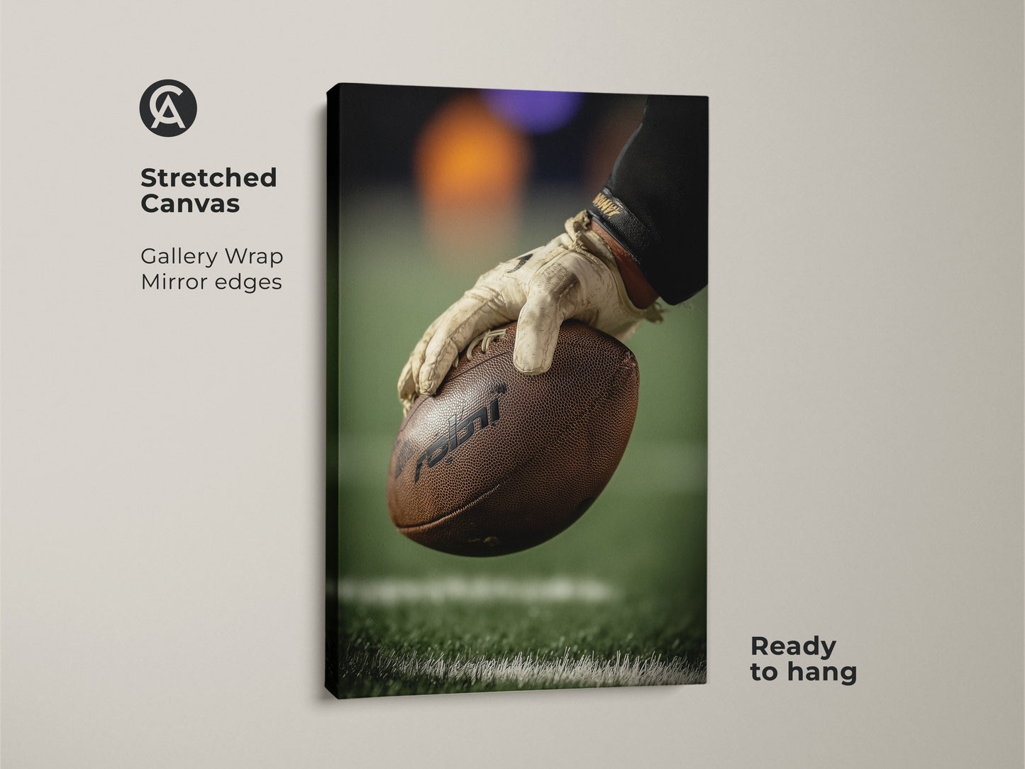 A stretched canvas gallery wrap displays football action photography. See a player's hand holding the ball close up. This sports art brings game day energy to any room. Ready to hang with mirrored edges this canvas print is great man cave decor.
