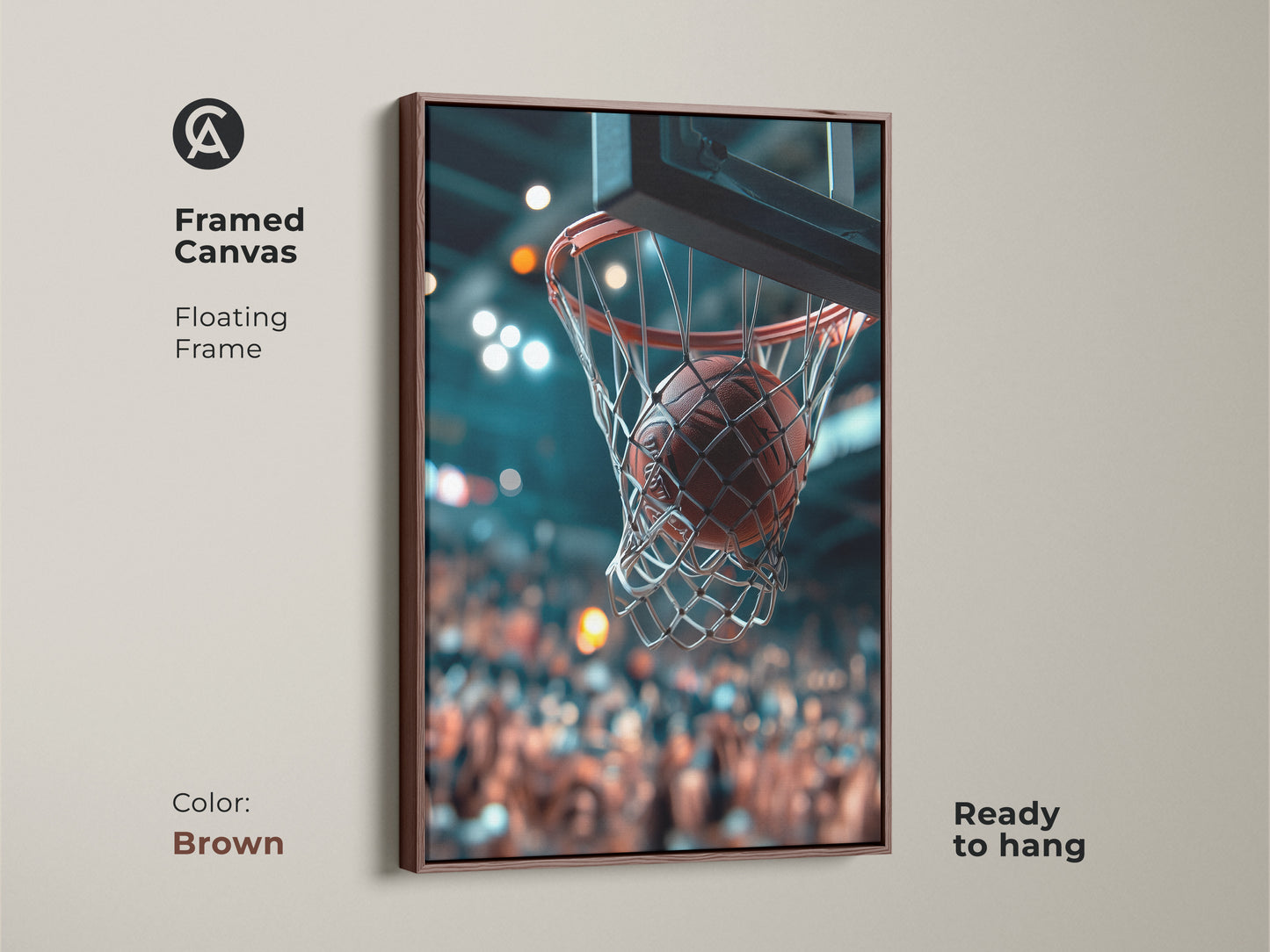 Framed canvas art in brown featuring a basketball going through the net. This floating frame is ready to hang. The crowd is blurred in the background. Add this artwork to your space for a sporty and stylish look.