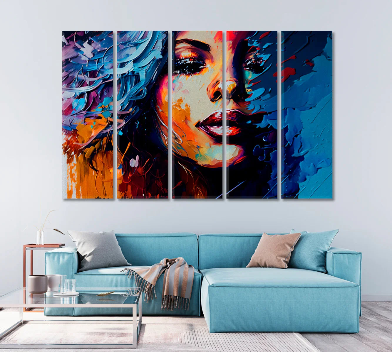 Abstract modern art canvas in teal and amber brushstrokes above a blue sofa