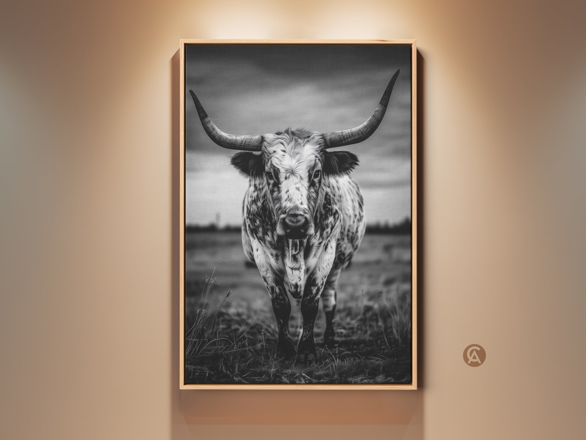 Dramatic black and white longhorn canvas print framed in natural wood. The rustic cow artwork brings a touch of Texas animal decor to any space. Its a striking entryway statement piece. The monochrome palette will complement farmhouse or modern interiors making it a versatile addition to your home or office.
