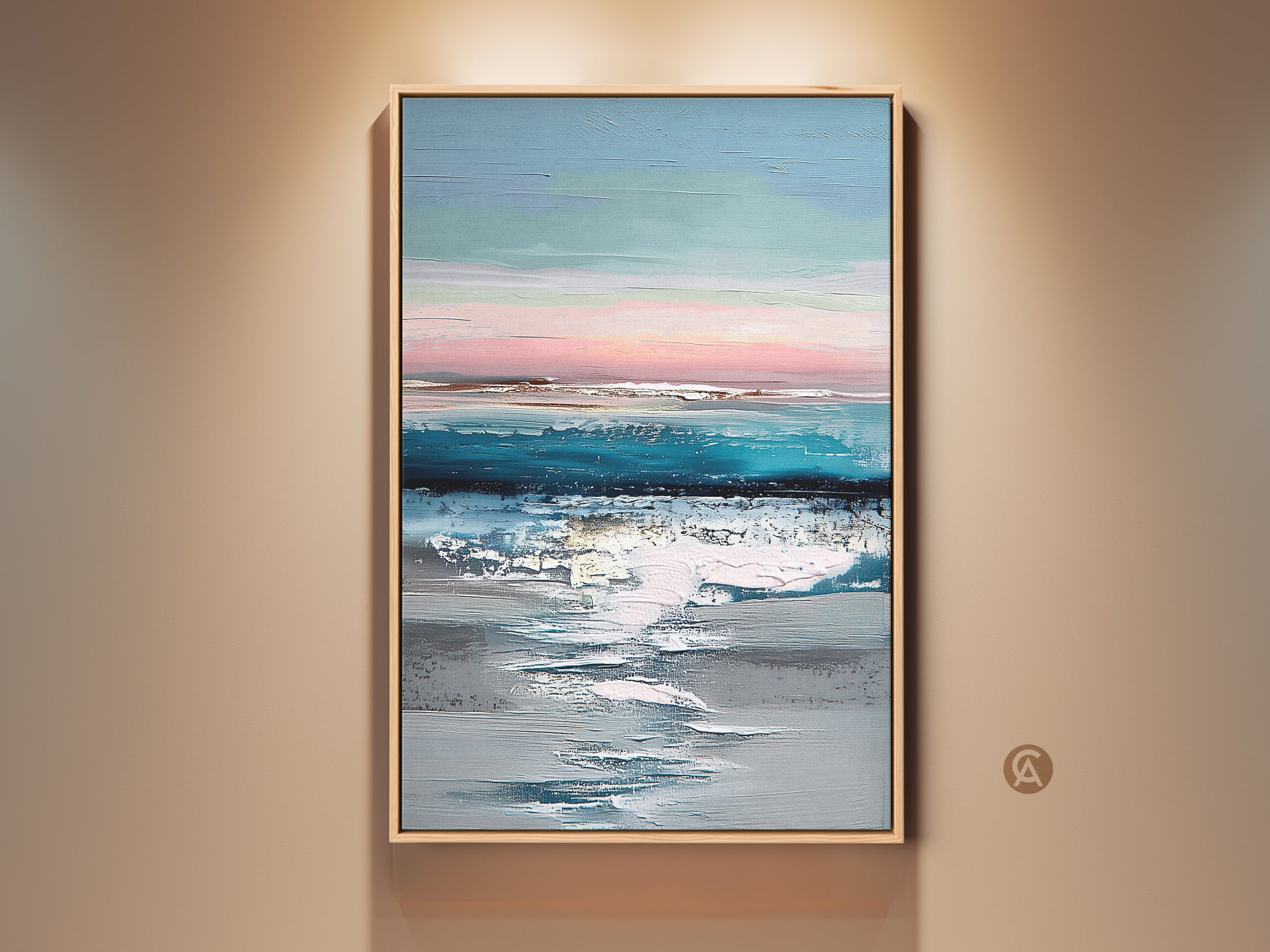 Framed abstract coastal canvas art displayed on a neutral wall. The teal blue and pink landscape print adds a modern touch. This textured ocean sky artwork is perfect for home decor. It creates a serene ambiance with its soft pastel hues and contemporary style.
