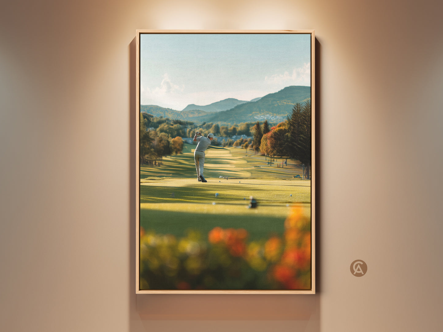 Framed golf course artwork captures a golfer mid-swing. The lush green fairway stretches towards distant mountains. This captivating art print brings the serenity of the golf course to any room. It is perfect for golf enthusiasts. The artwork is displayed in a warm-toned frame.