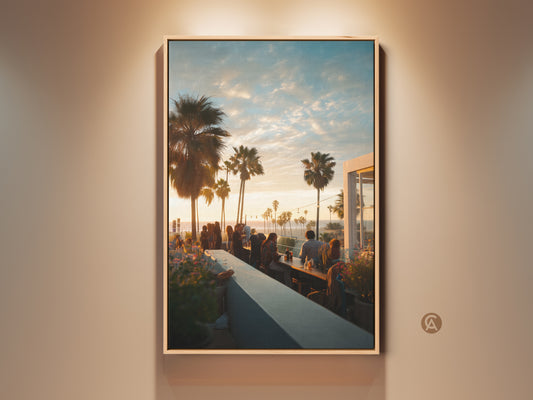 Framed canvas artwork of a sunset view from a rooftop bar. The print features palm trees and people enjoying the scene. This fine art makes a great addition to any home decor. Get yours today!