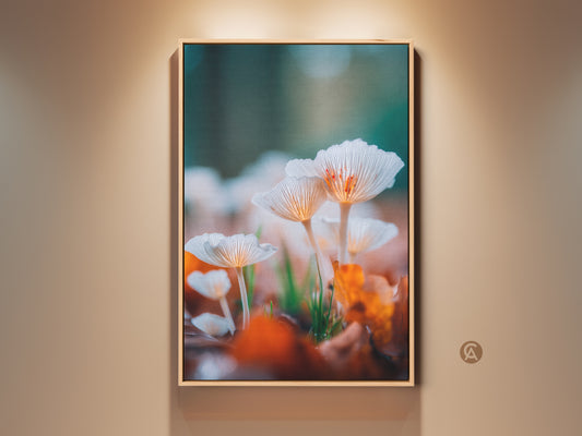 Framed mushroom art print. This nature-inspired artwork showcases a close-up of delicate white mushrooms. The print is framed in a natural wood tone. It's perfect for adding a touch of organic beauty to your living space.