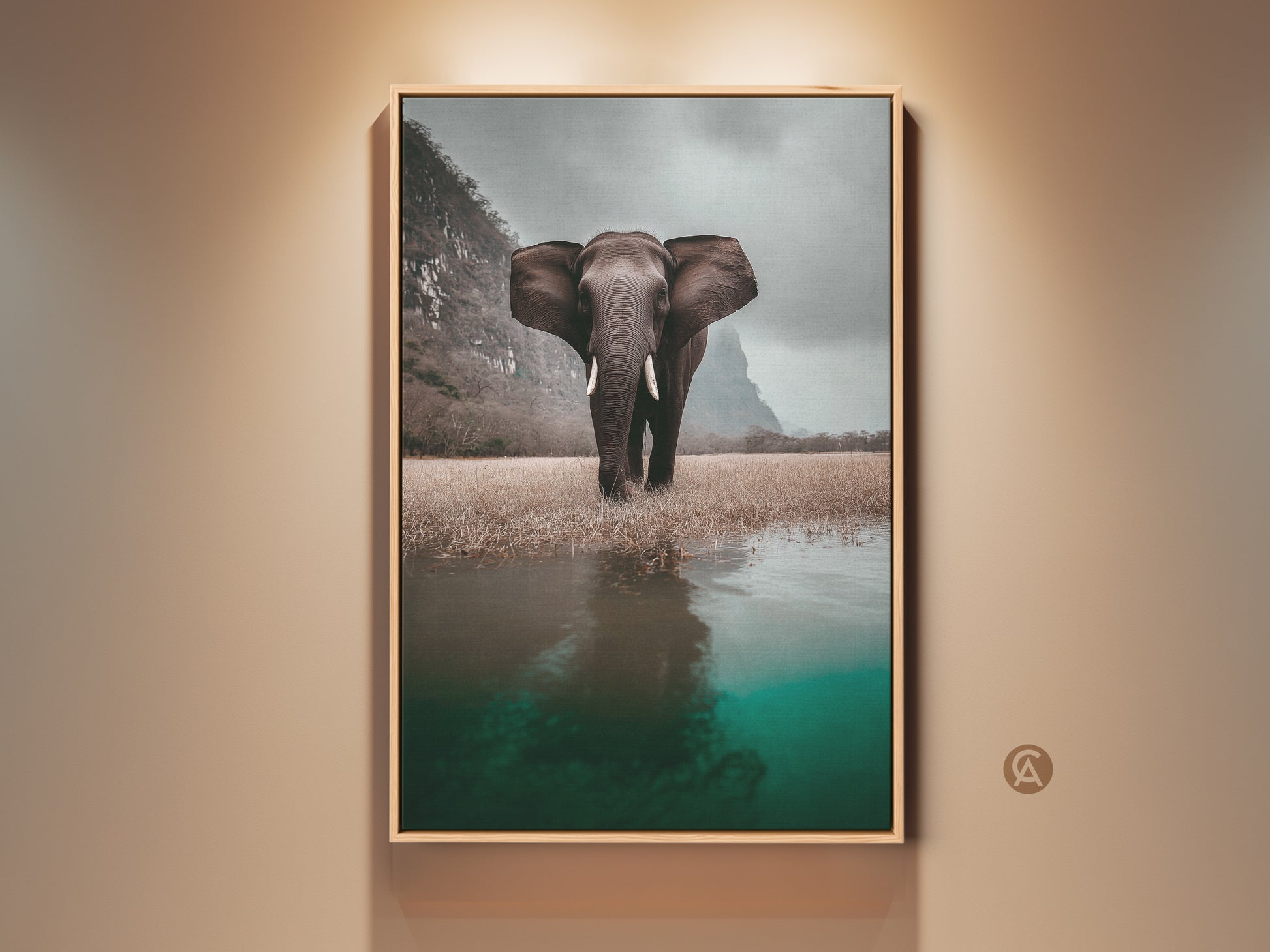 Framed elephant canvas art displayed in a living room. This wildlife landscape print features a photorealistic animal in its savanna habitat. Brown frame complements the eclectic home decor and teal water reflection. A thoughtful housewarming gift for animal lovers. This animal artwork adds natural history charm to any residential wall.