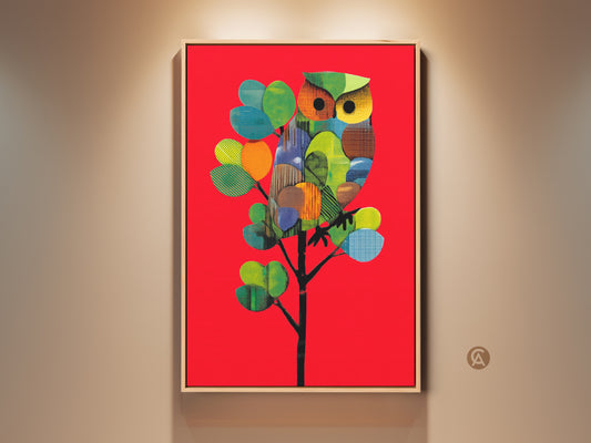 Vibrant geometric owl art print displayed in a wood frame. The modern folk style artwork features red orange and green colors. This abstract nature decor is perfect for eclectic home accent wall art.