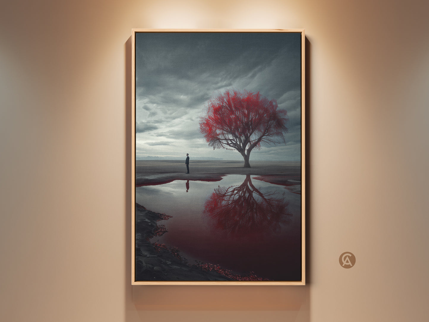 Contemporary canvas art print showcases a surreal desert landscape. A lone man gazes at a vibrant red tree mirrored in water. The moody artwork uses deep greys blacks and red. It creates a thought-provoking atmosphere. Perfect as housewarming gift or for surrealism art collections.