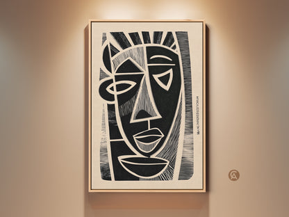 A framed cubist abstract face print hangs on a beige wall. The black and beige linocut wall art adds an eclectic touch. This portrait canvas enhances an entryway or modern home office. It's striking monochrome home decor for art enthusiasts.