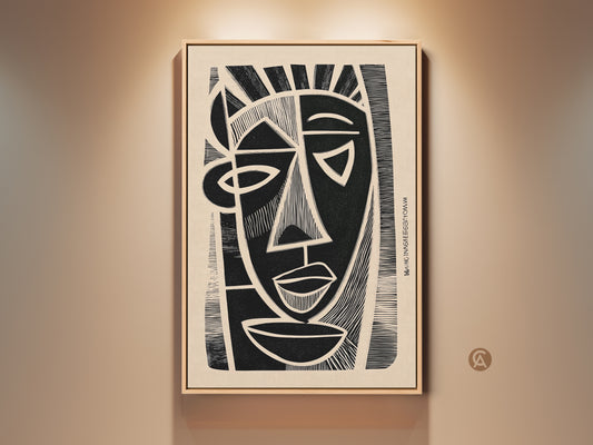 A framed cubist abstract face print hangs on a beige wall. The black and beige linocut wall art adds an eclectic touch. This portrait canvas enhances an entryway or modern home office. It's striking monochrome home decor for art enthusiasts.