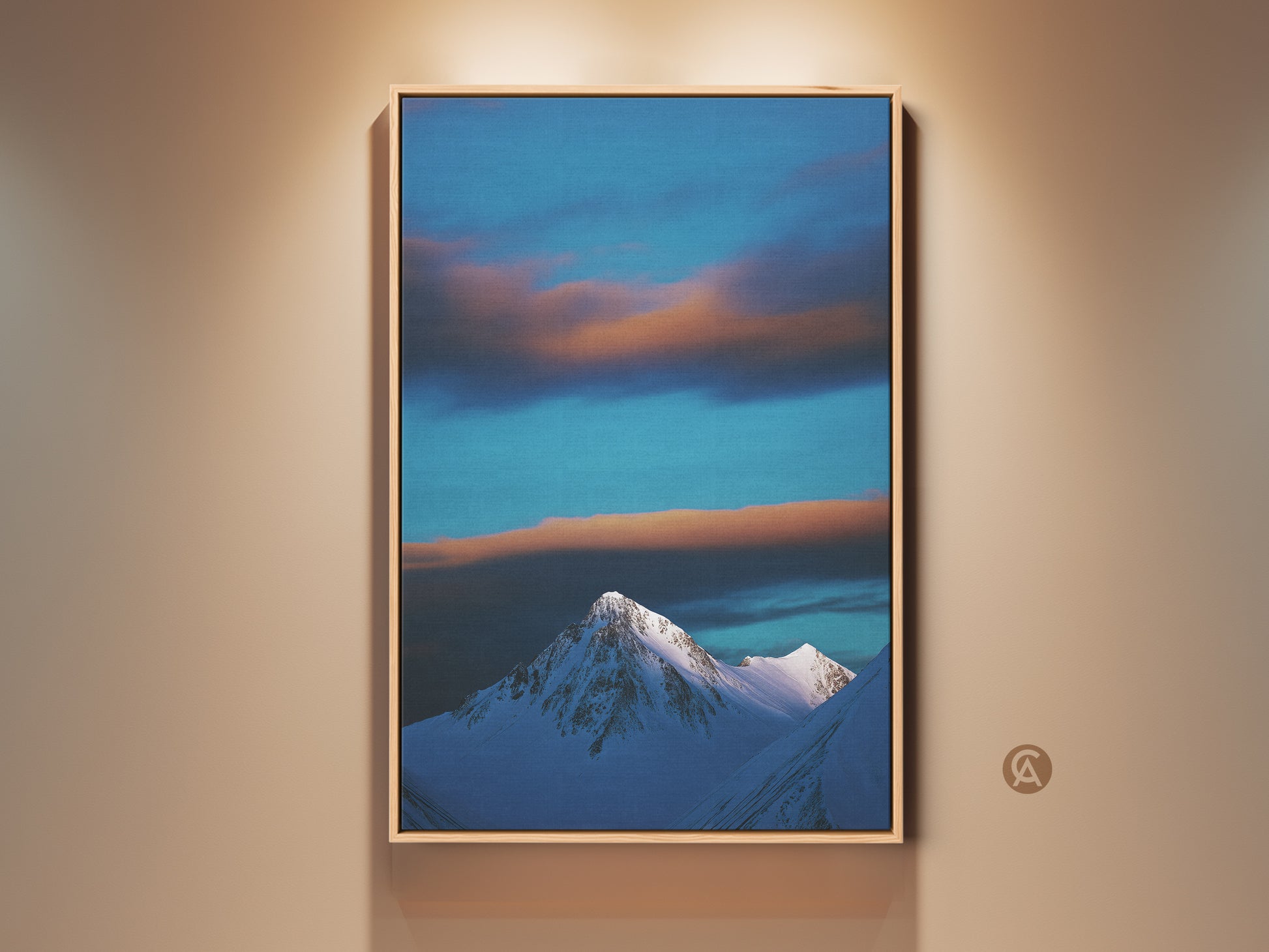 Winter Mountain Canvas Print showcases a snowy peak under a blue sky. Wispy clouds add depth to this landscape photography wall art. The contemporary nature artwork is framed adding a refined touch. A perfect housewarming gift for minimalist home decor.