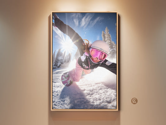 Snowboarder in action wall art. This dynamic winter sports canvas print features a snowboarder carving through snow. The blue and pink mountain decor adds a modern touch. A perfect gift for snowboarders.