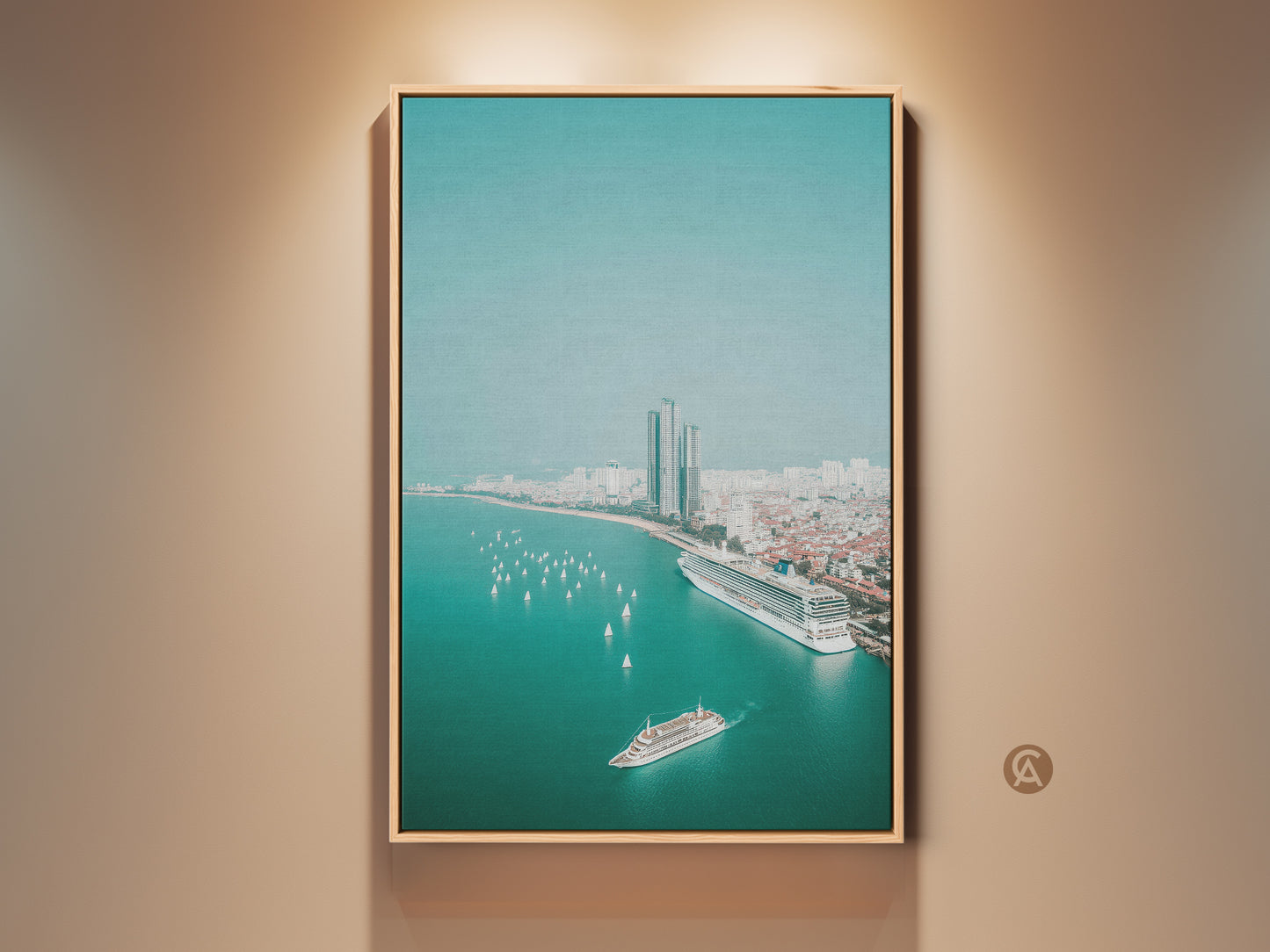Teal ocean cityscape canvas print in a natural wood frame. An aerial view shows a cruise ship sailboats city buildings and the ocean. This coastal artwork is a contemporary travel gift idea and nautical themed art for living room decor.