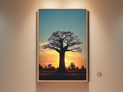 Framed Sunset Baobab Tree artwork. This piece features an African silhouette landscape. The warm orange and yellow hues create a boho bedroom wall decor. A unique travelers gift idea. Add a touch of serene nature to your home.