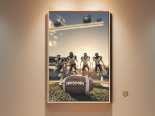Modern American Football art print displayed in a living room. The framed canvas showcases a football on the field. Players are visible in the background. This sports action wall decor is ideal for a man cave or a football fan's gift. This artwork adds team spirit to any space.