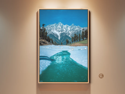 Blue Snowy Mountain Canvas Print displayed in a room setting. This realistic winter landscape wall art captures the serene beauty of nature. Perfect as home decor or a thoughtful housewarming gift for mountain lovers. Ready to hang and adds a touch of modern elegance.