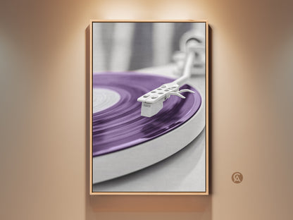 Framed purple turntable art print. This minimalist mid-century modern art piece features a vinyl record player. The artwork adds a retro music vibe to your home office decor. A perfect gift for music enthusiasts. The floating frame enhances the modern abstract wall art.