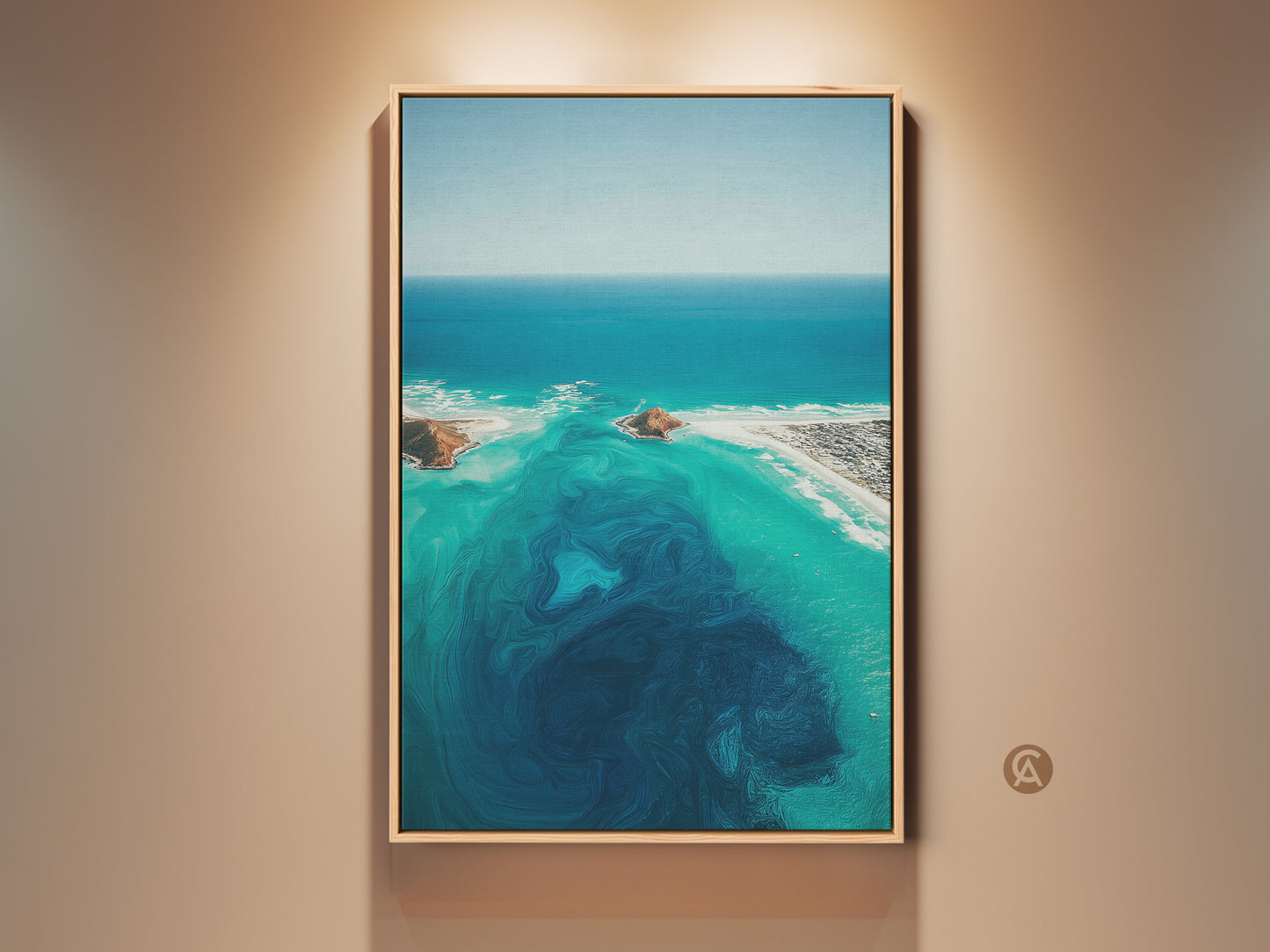 Framed aerial ocean abstract canvas print. This turquoise coastal landscape wall art features deep blue swirls. The beach house decor is a perfect gift for the home. This wall art adds a modern touch.
