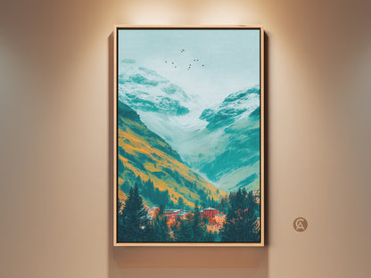 Framed mountain valley art print. The landscape art features a teal valley with orange and white mountains. A small village sits nestled among evergreens below a flock of birds. The artwork is framed in a blonde wood.