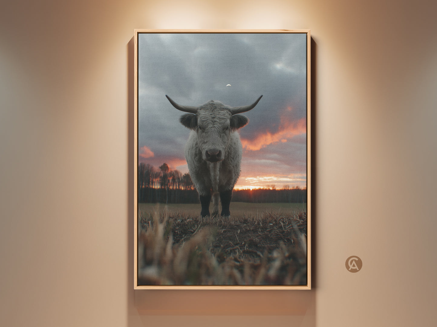 Rustic Highland cow canvas art print. This farmhouse sunset landscape artwork adds country charm to any room. Perfect as animal wall decor or a cozy housewarming gift. The soft grey cow stands out against an orange sky. A serene addition for nature and animal lovers.